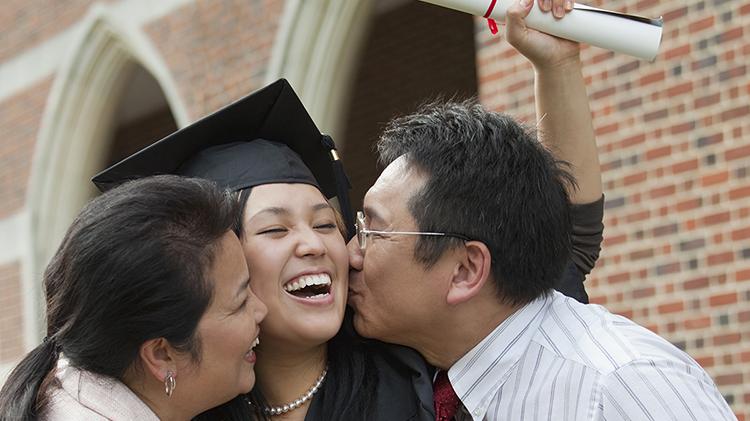 Man and woman with graduate.